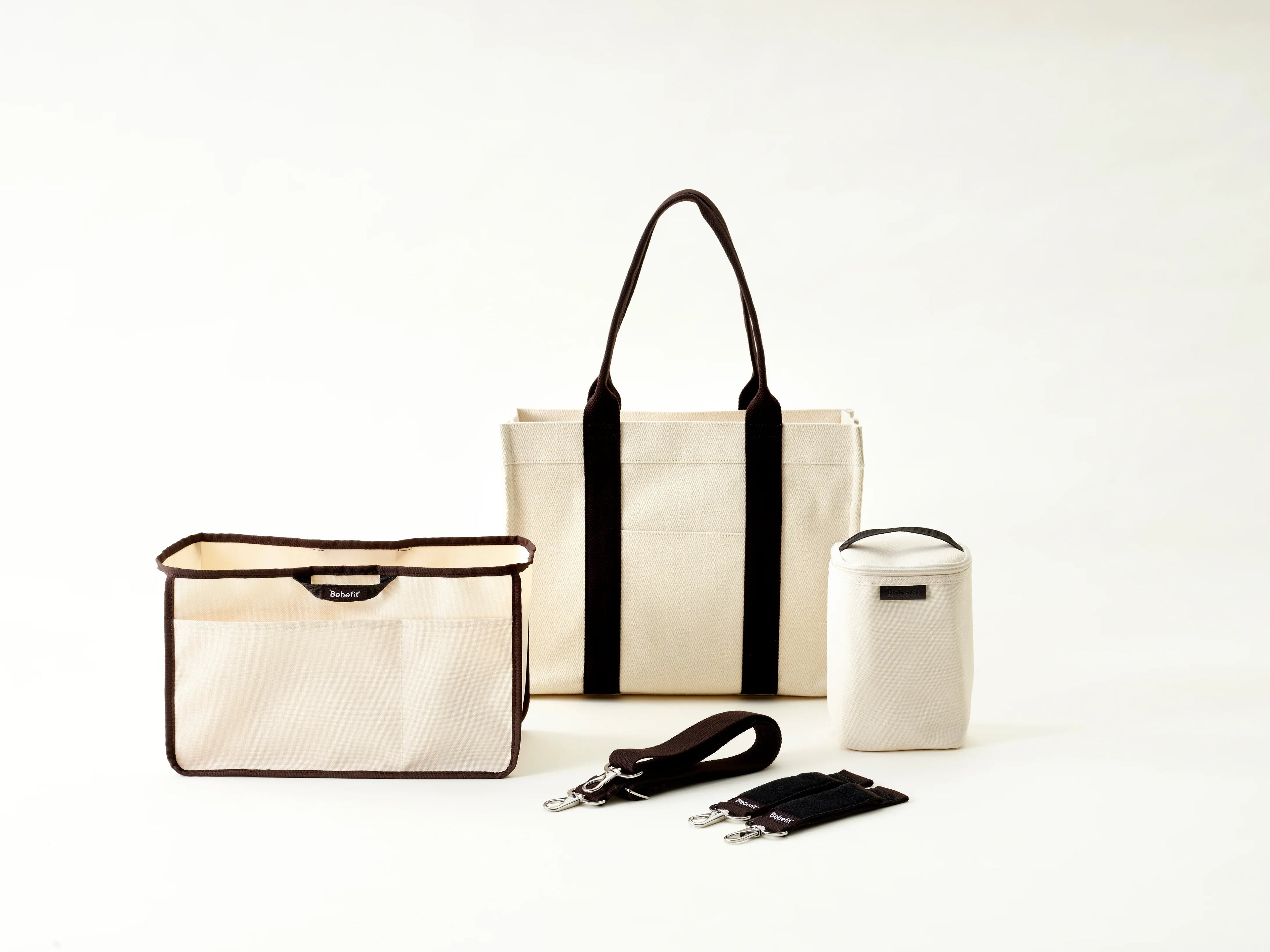 Bebefit.eu Tote Organizer Set with beige and black diaper bag, insulated bottle holder, straps, and divider.