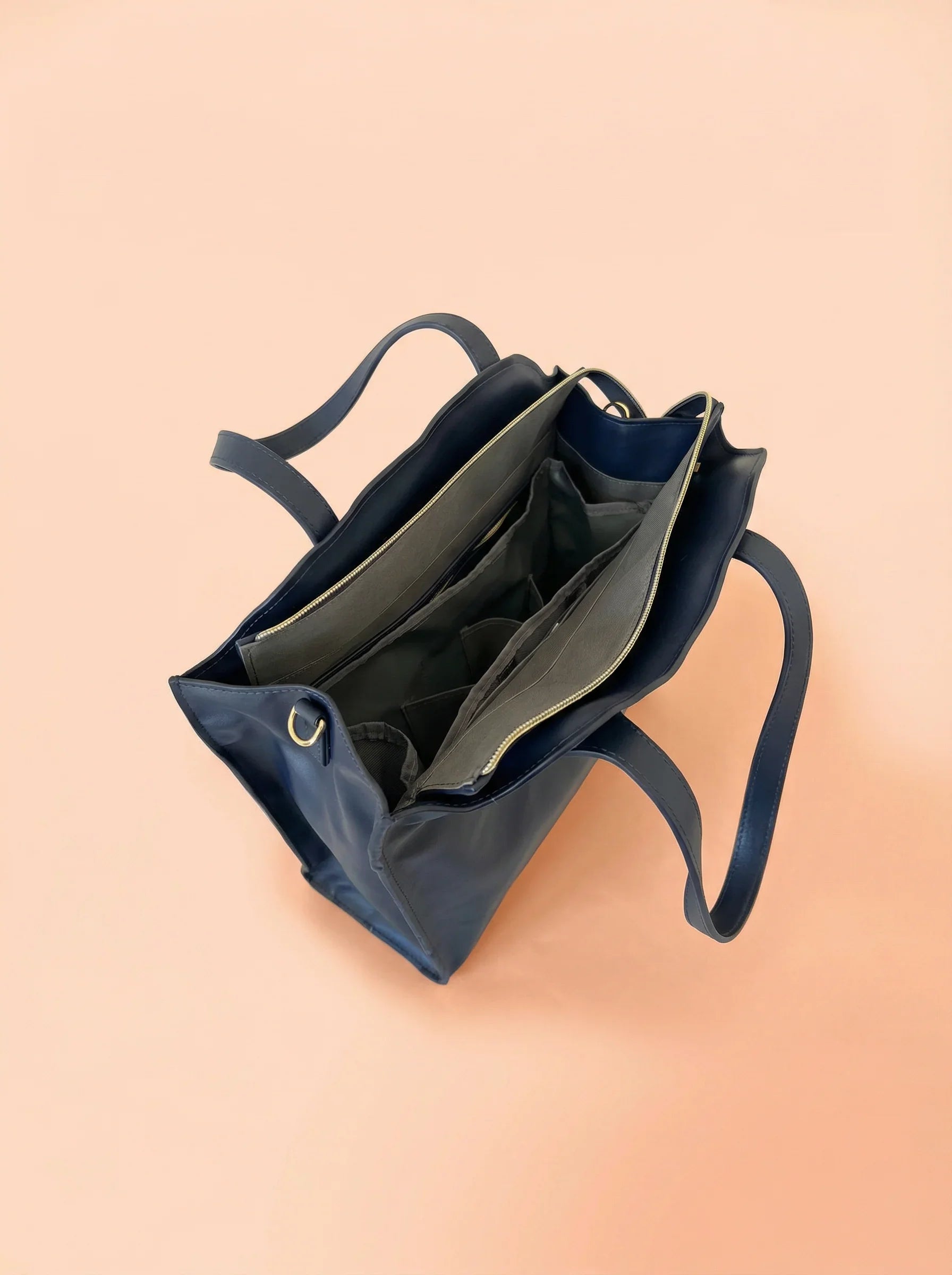 bebefit.eu Navy blue diaper bag with organized interior compartments, product title visible