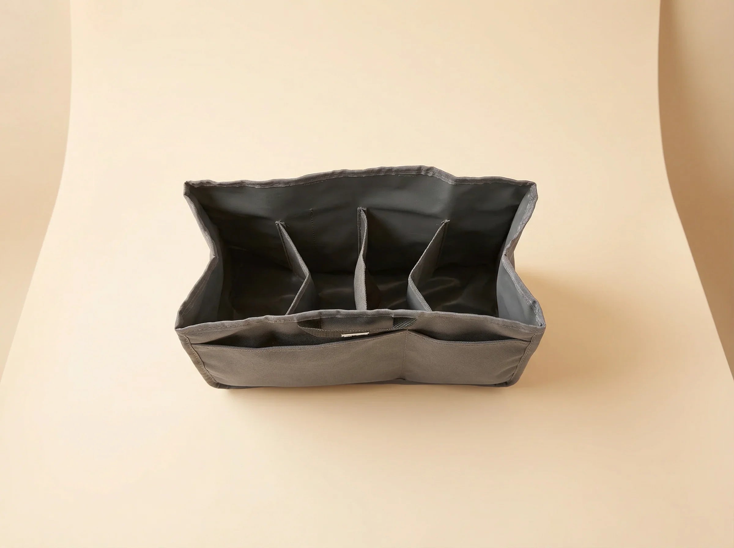 bebefit.eu Organizer Insert, gray fabric bag divider with multiple compartments on beige background