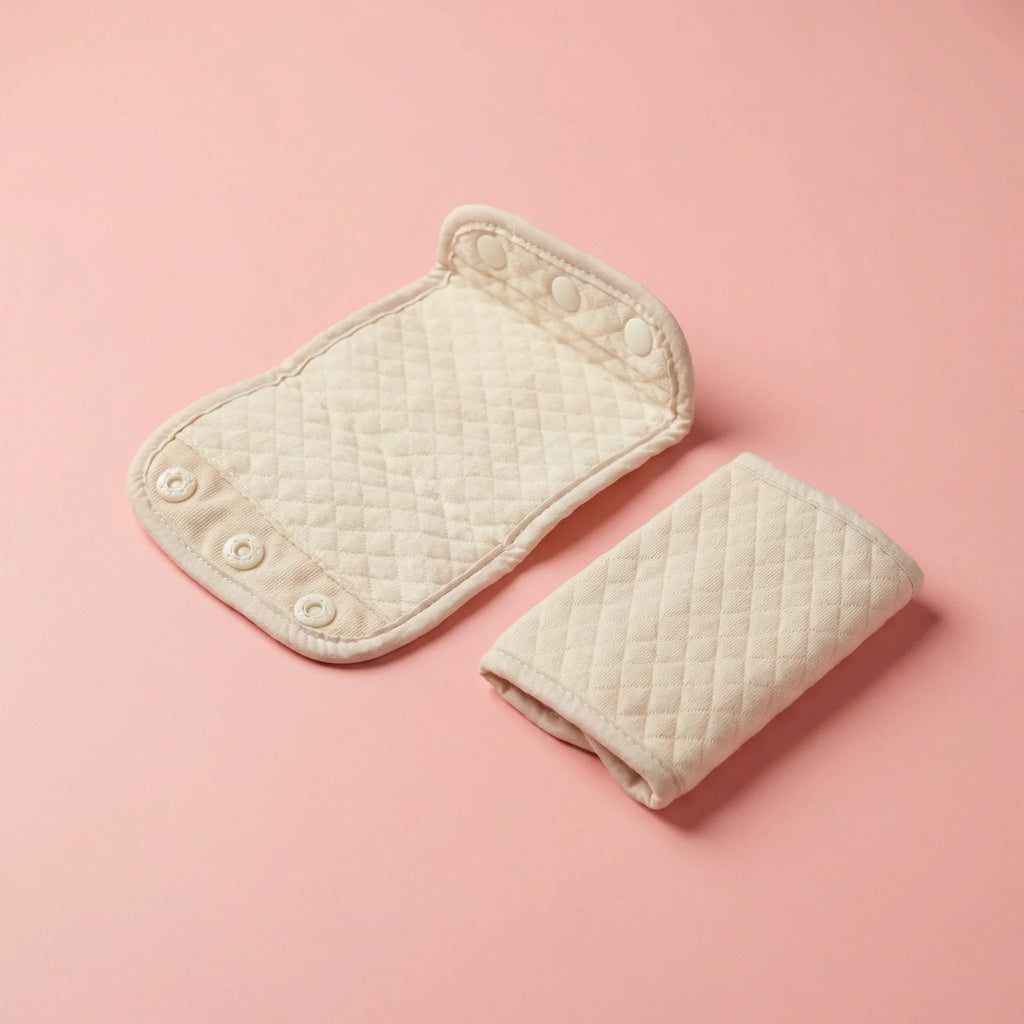 bebefit.eu Baby Carrier Drool Pads, quilted beige cotton with snap buttons on pink background