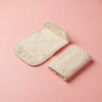 bebefit.eu Baby Carrier Drool Pads, quilted beige cotton with snap buttons on pink background